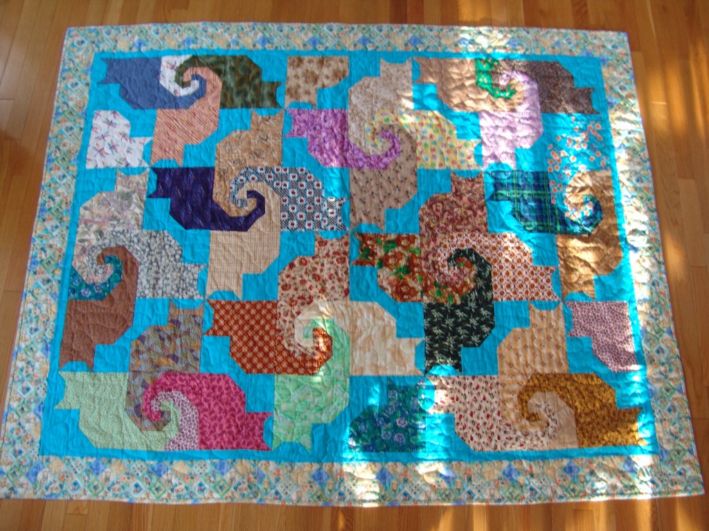 Kool Kats Kwilt patterned. My grandma made one and I decided I liked it and wanted to make one for my first-cousin once removed; who likes Cats. finished in November of 2009